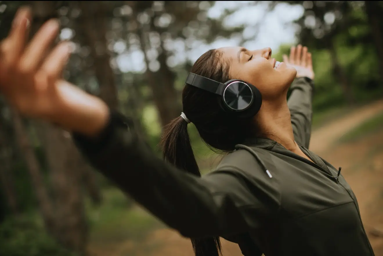 Peaceful Christian woman worshipping – worship songs to overcome anxiety and find peace