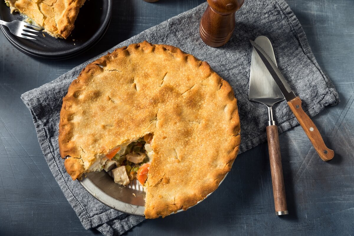 Golden-brown chicken pot pie with flaky crust and creamy chicken-vegetable filling