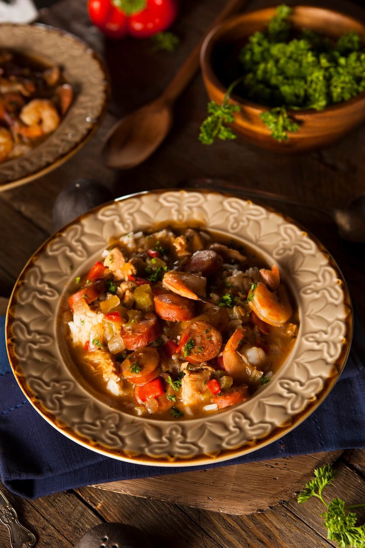 Louisiana chicken and sausage gumbo served over rice with Cajun seasoning