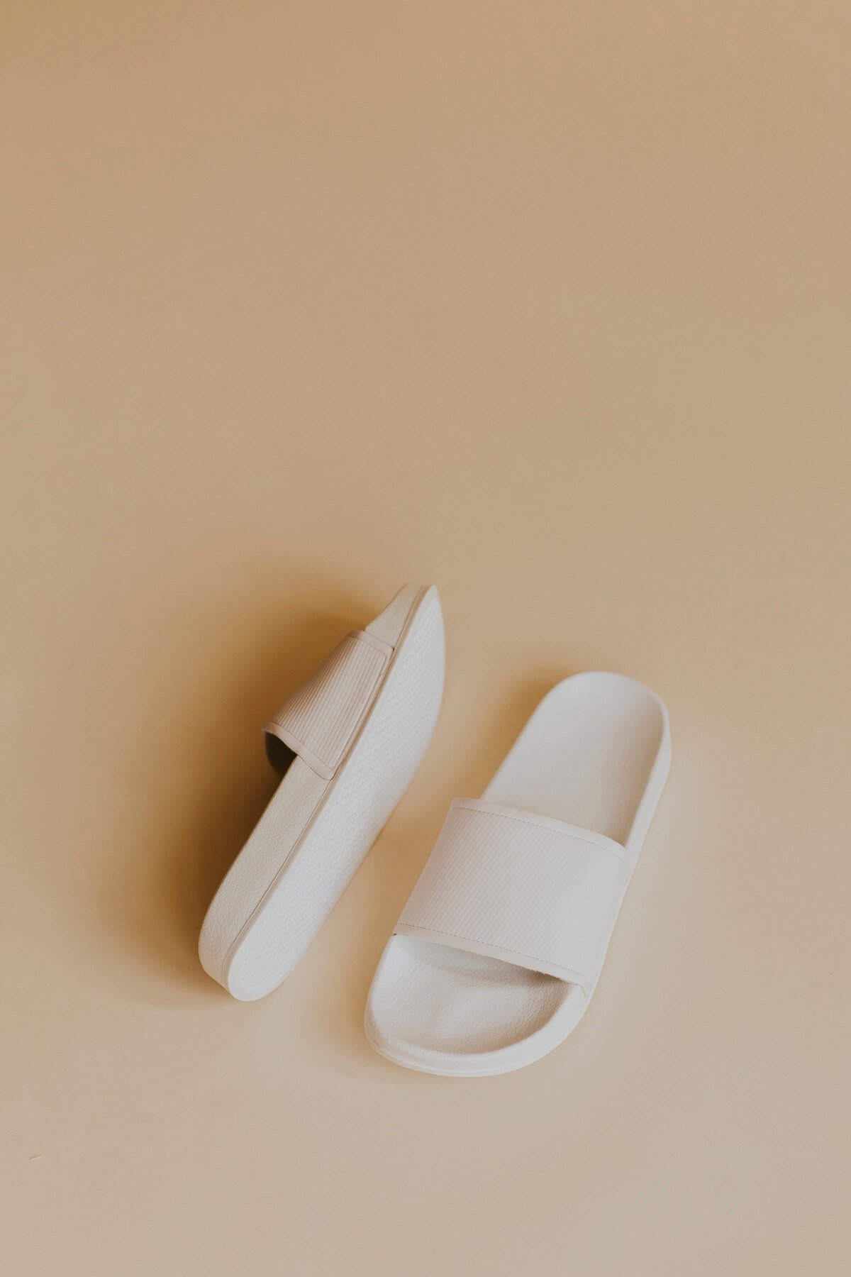 Pair of comfortable slides for women as a practical and thoughtful gift idea.