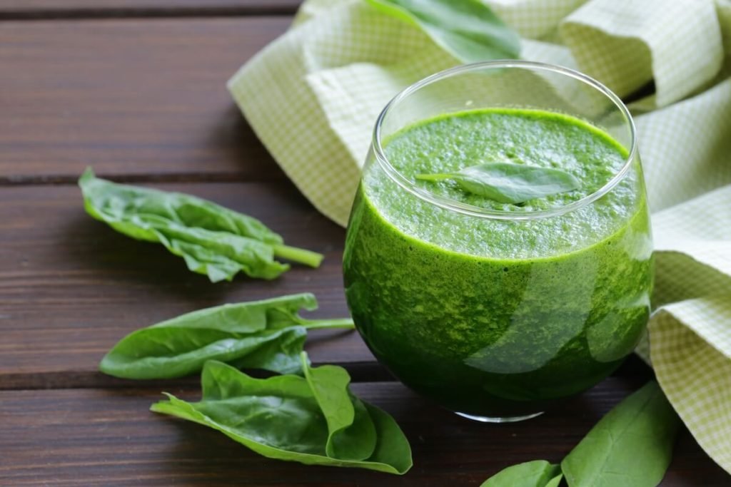 Spinach green smoothie packed with vitamins for glowing skin and youthful energy