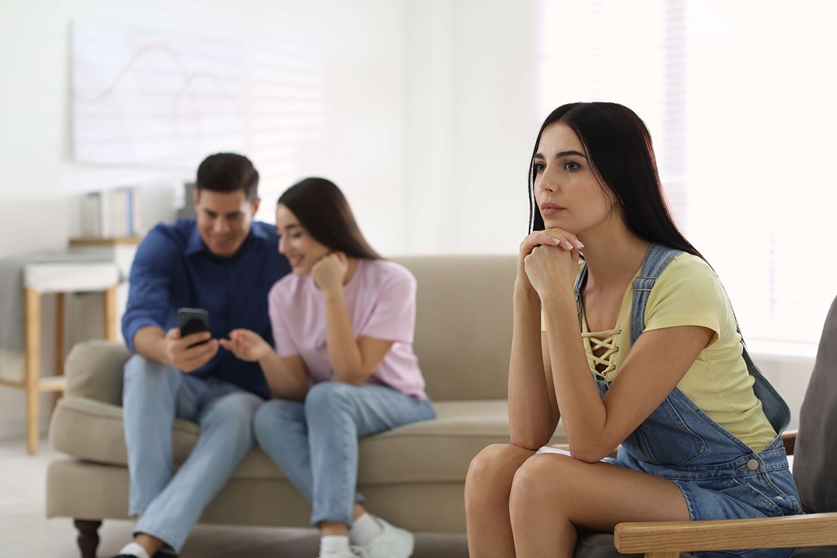 Woman feeling discouraged while comparing herself to others.