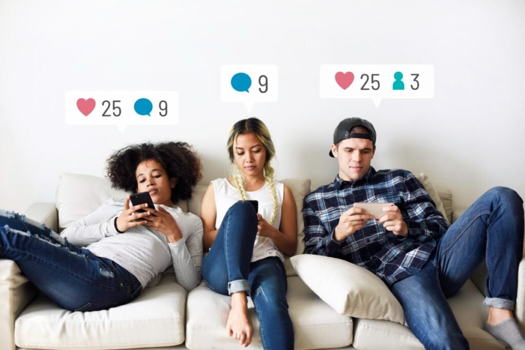 Young adults checking social media on their phones
