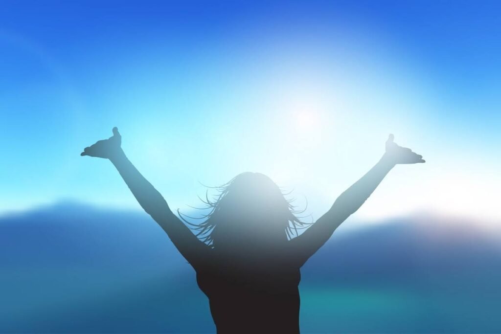 Woman worshiping with her hands raised