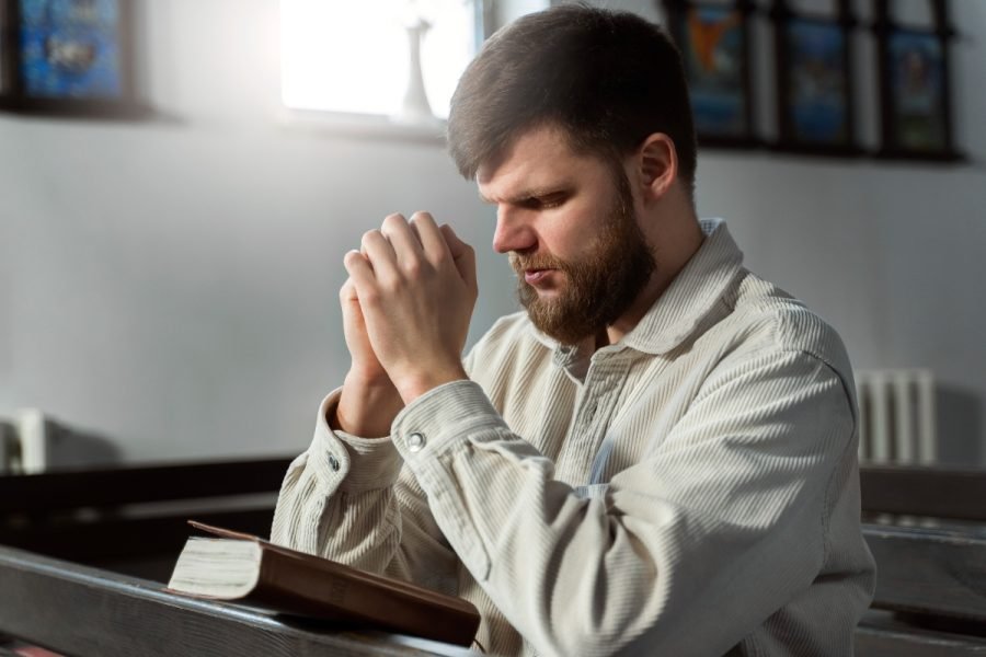 Man praying in church