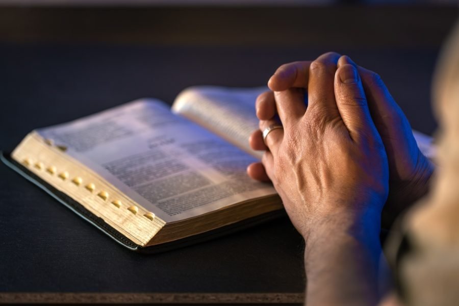 Woman finding peace through faith over fear.