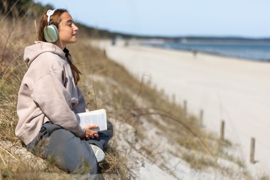 Teenage girl reading a book on the seashore. Girl listening to music on the seashore. High quality photo. Meditation on the seashore. Space for text. SSUCv3H4sIAAAAAAAAA41P0W6DMAz8Fz+DFAhshV+p9hASQ60CqRKzakL59zmUaq/Lg3Xni33nHchBD83ojB21KivbSKlGVQ62rstGd7ptdYdmdFCAM4zQV1pfuotSbf2hPrWSV8BgIlnod6B53iIHw+RX6EUJuDoMB0RH7AOZWVgqILLhLWKUMWFWdk+iHvy977rnvgQU87gNGaTin72vAsyEq/3J+1MOMqM57K4i3Z+MYTm9Pd9yxAwfgSyt05lJTvHLC6+e8+zhwN7eyZ3DrzNuJN2QvWB7zN44dKe8DQsxv2nAb8Ln3++U0i+PS4NGhAEAAA==